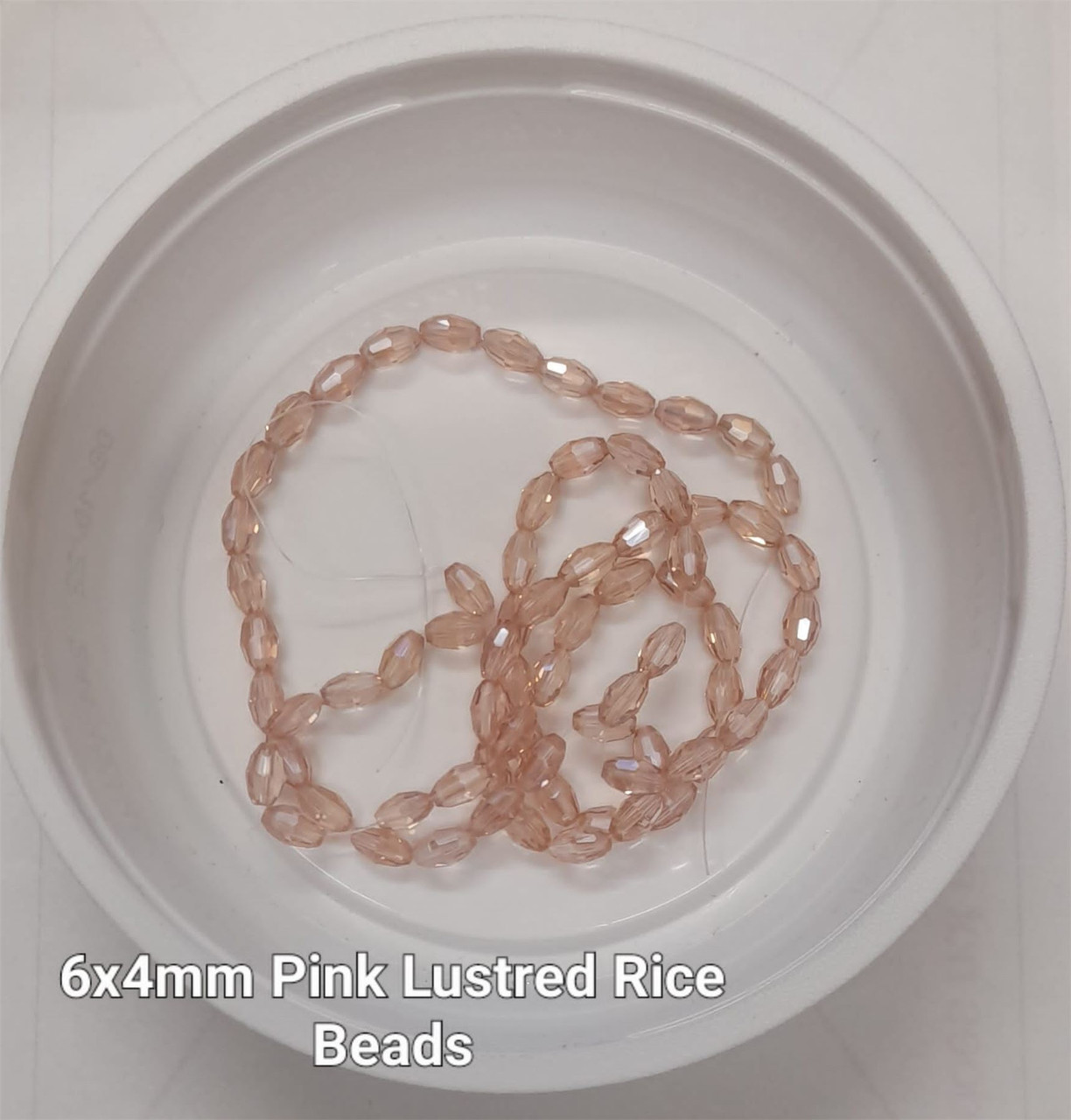 Strand of faceted rice glass beads - approx 6x4mm, Pink Lustered, approx 72 beads