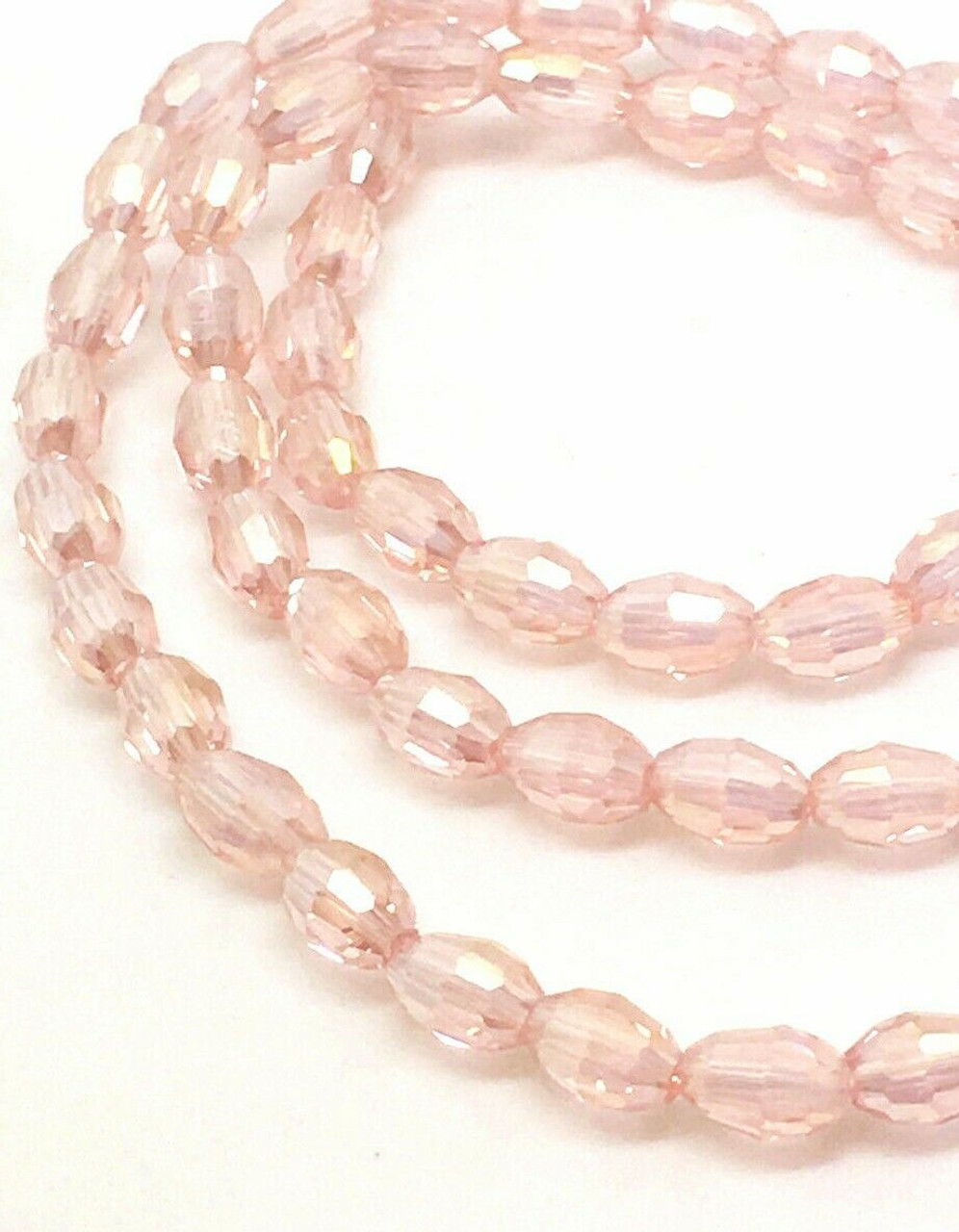 Strand of faceted rice glass beads - approx 6x4mm, Pale Pink AB, approx 72 beads