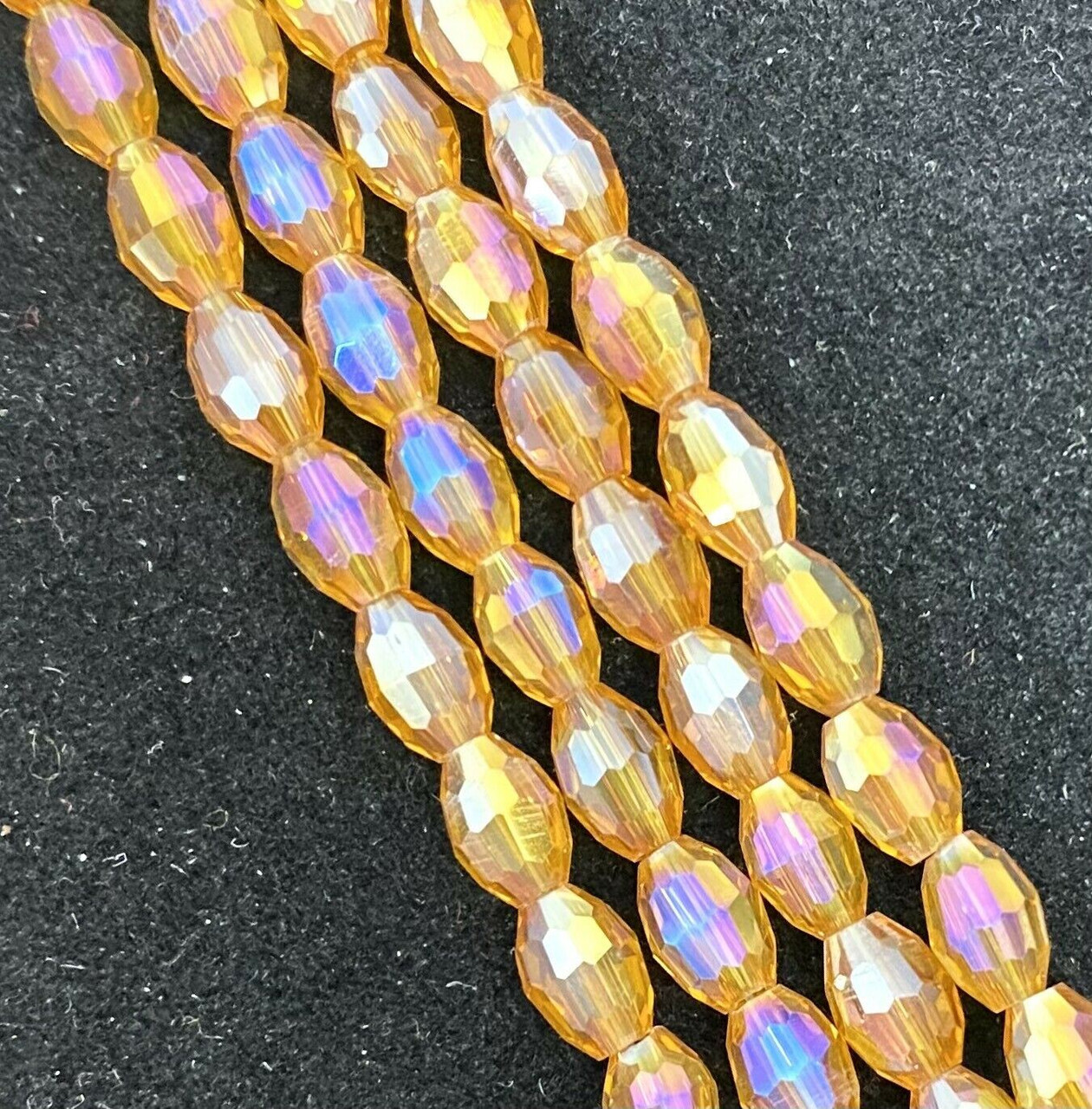 Strand of faceted rice glass beads - approx 6x4mm, Gold AB , approx 72 beads