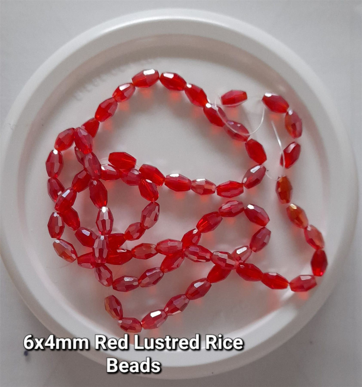 Strand of faceted rice glass beads - approx 6x4mm, Red Lustered, approx 72 beads