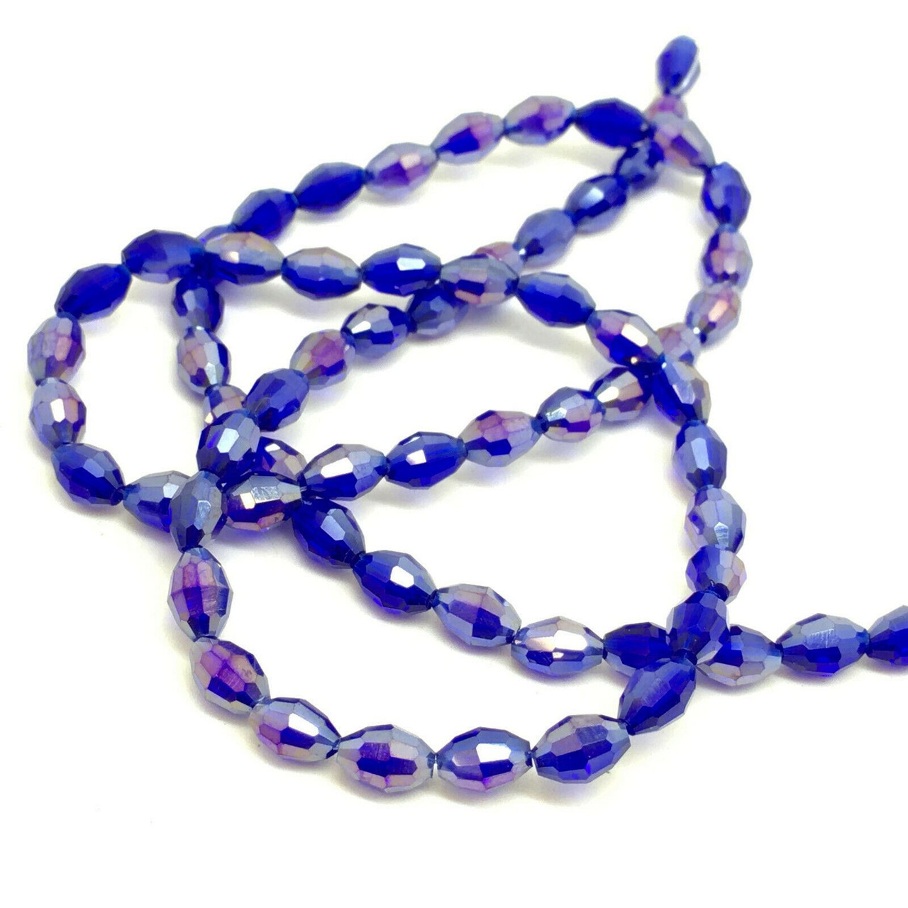 Strand of faceted rice glass beads - approx 6x4mm, Deep Blue AB , approx 72 beads