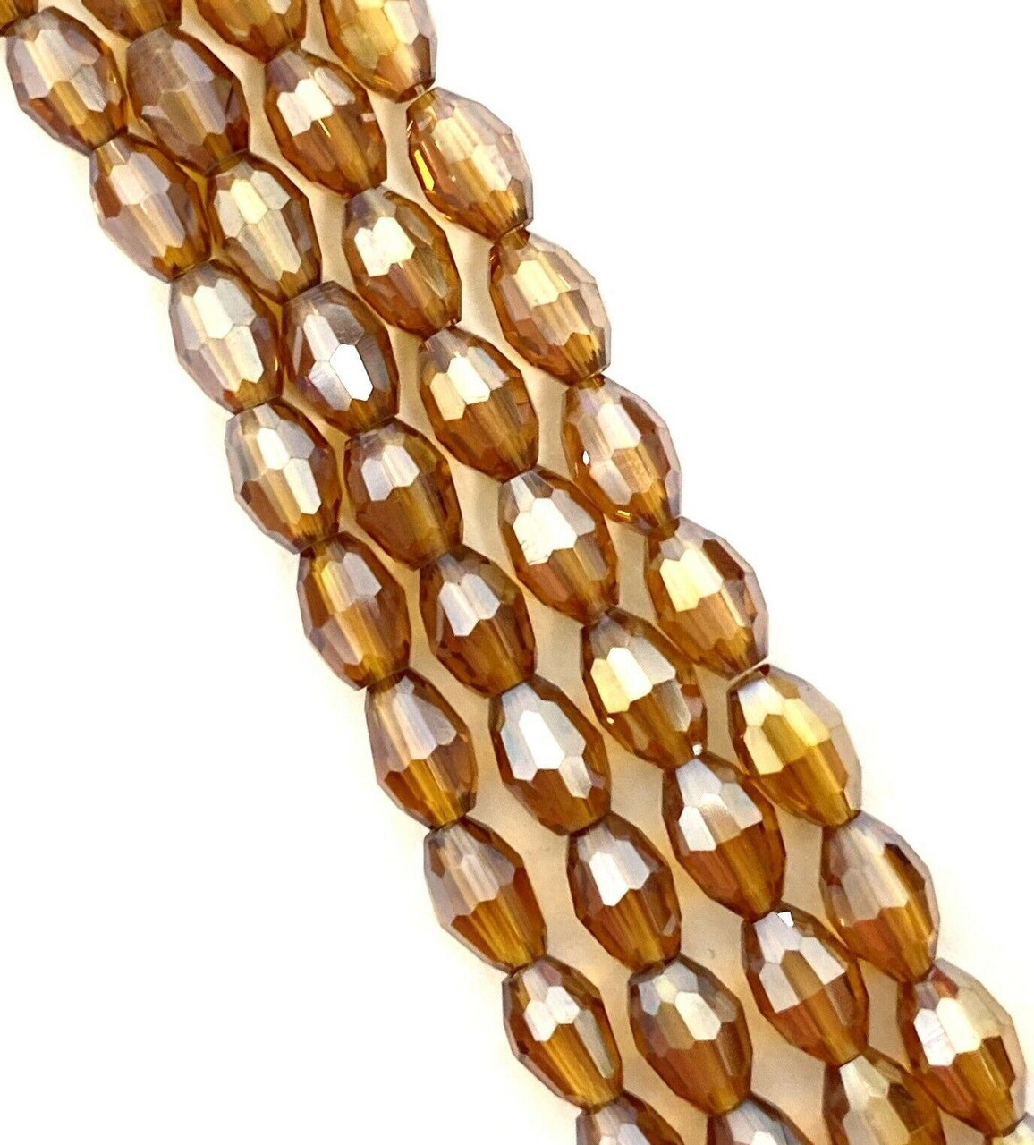 Strand of faceted rice glass beads - approx 6x4mm, Amber Lustered , approx 72 beads