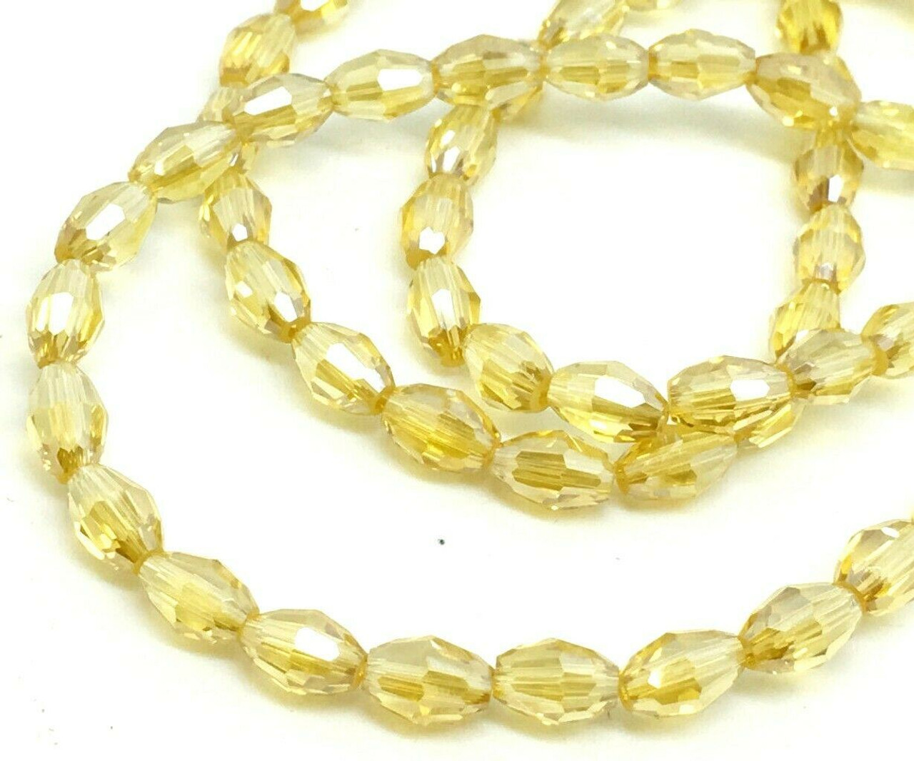 Strand of faceted rice glass beads - approx 6x4mm, Pale Yellow Lustered , approx 72 beads