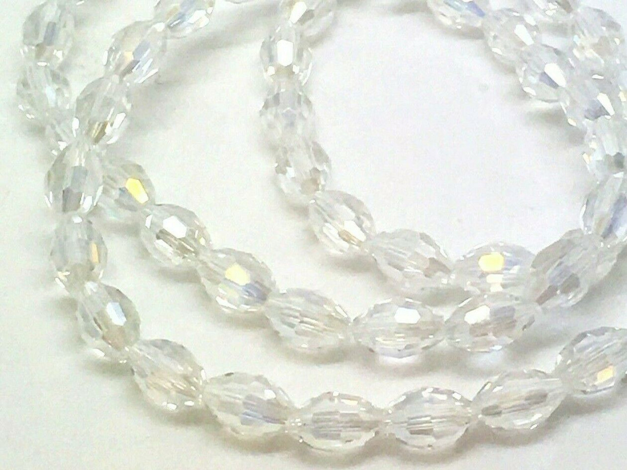 Strand of faceted rice glass beads - approx 6x4mm, Clear AB, approx 72 beads