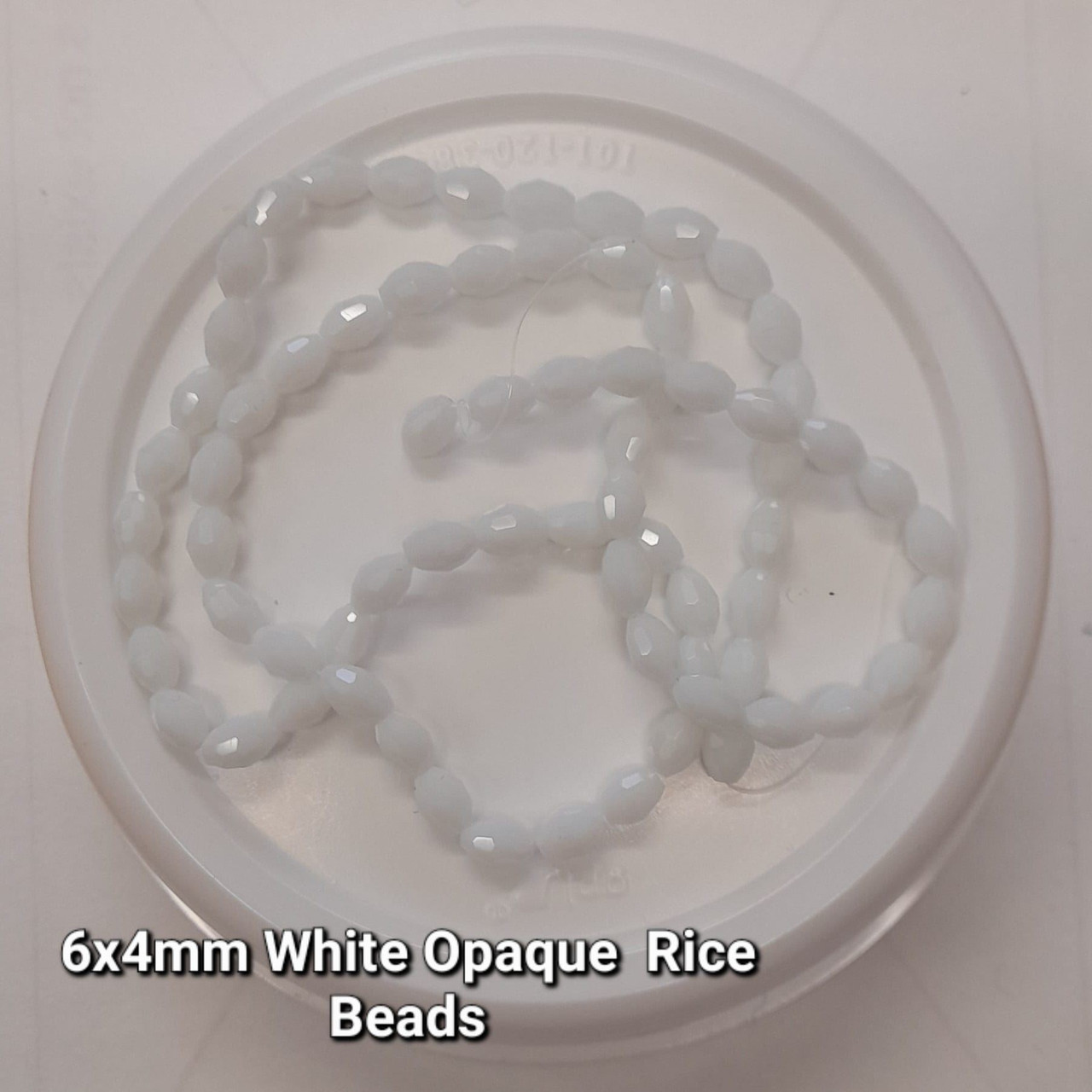 Strand of faceted rice glass beads - approx 6x4mm, White Opaque, approx 72 beads