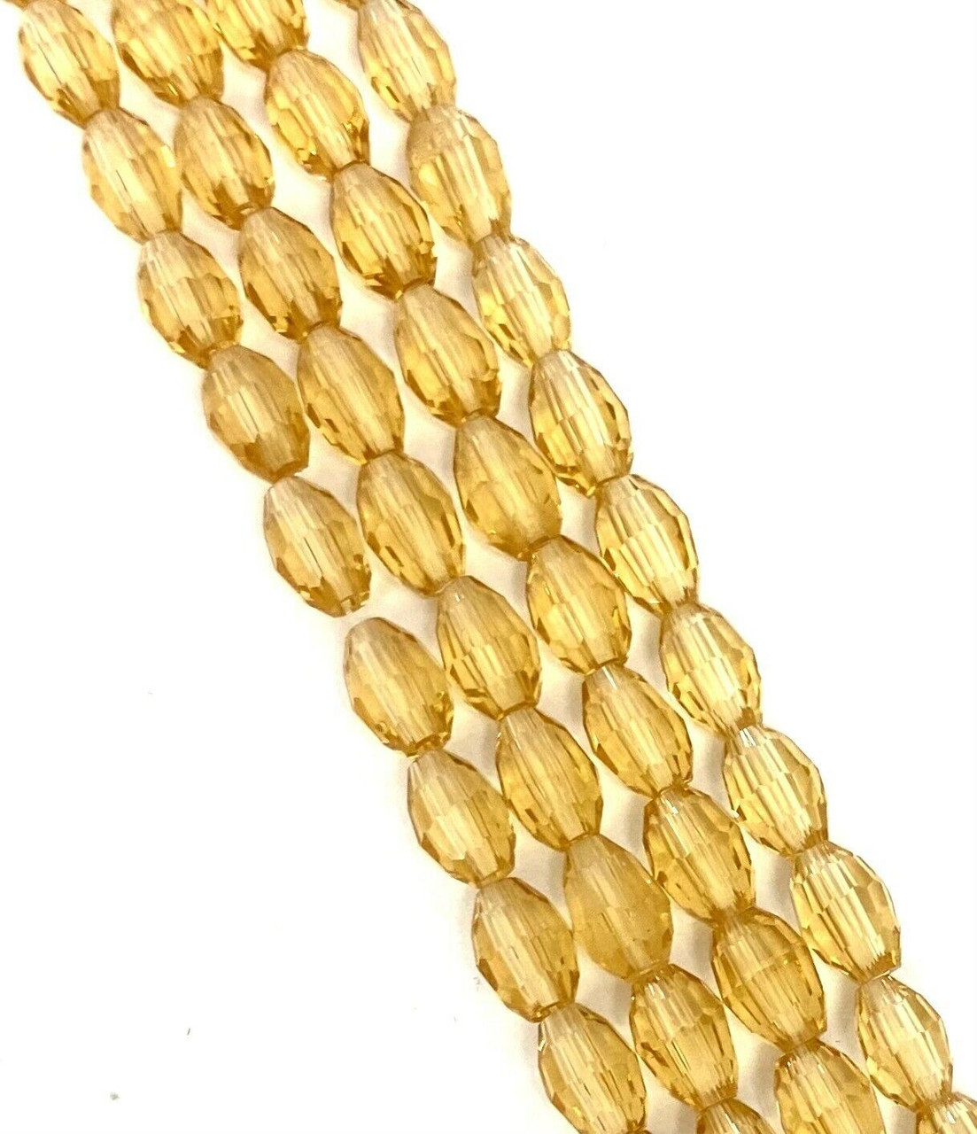 Strand of faceted rice glass beads - approx 6x4mm, Pale Gold, approx 72 beads