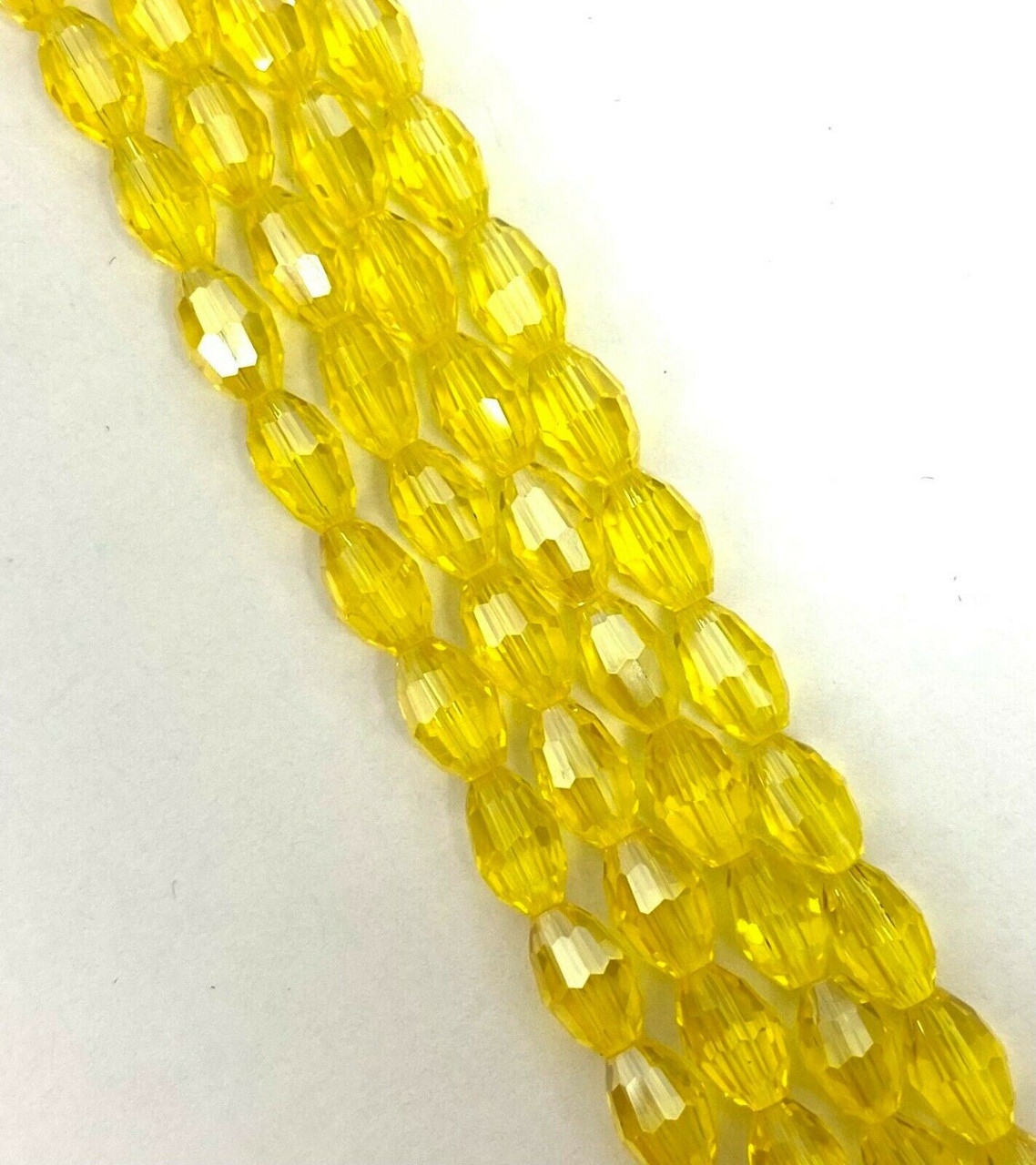 Strand of faceted rice glass beads - approx 6x4mm, Yellow, approx 72 beads