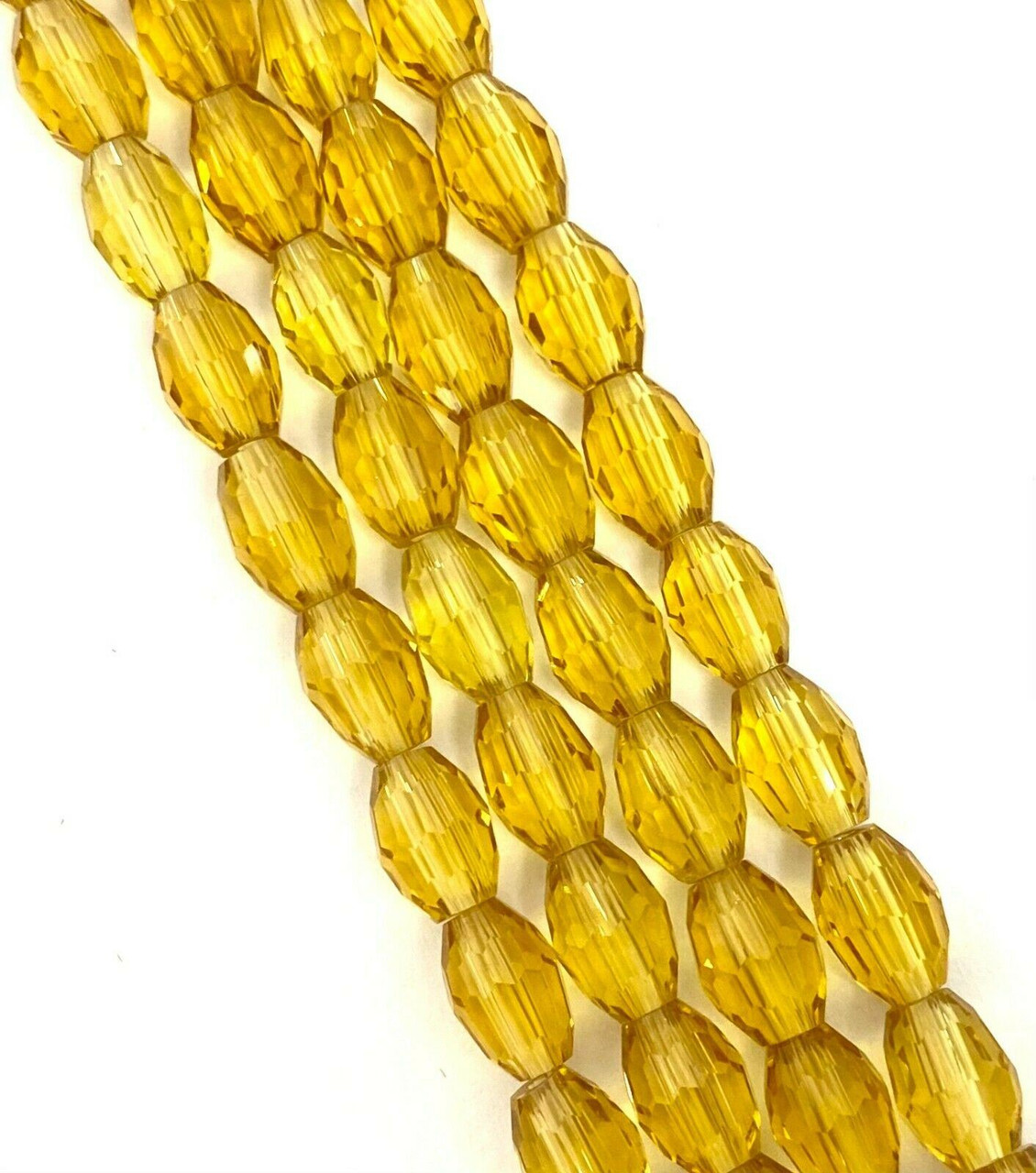 Strand of faceted rice glass beads - approx 8x6mm, Gold, approx 72 beads