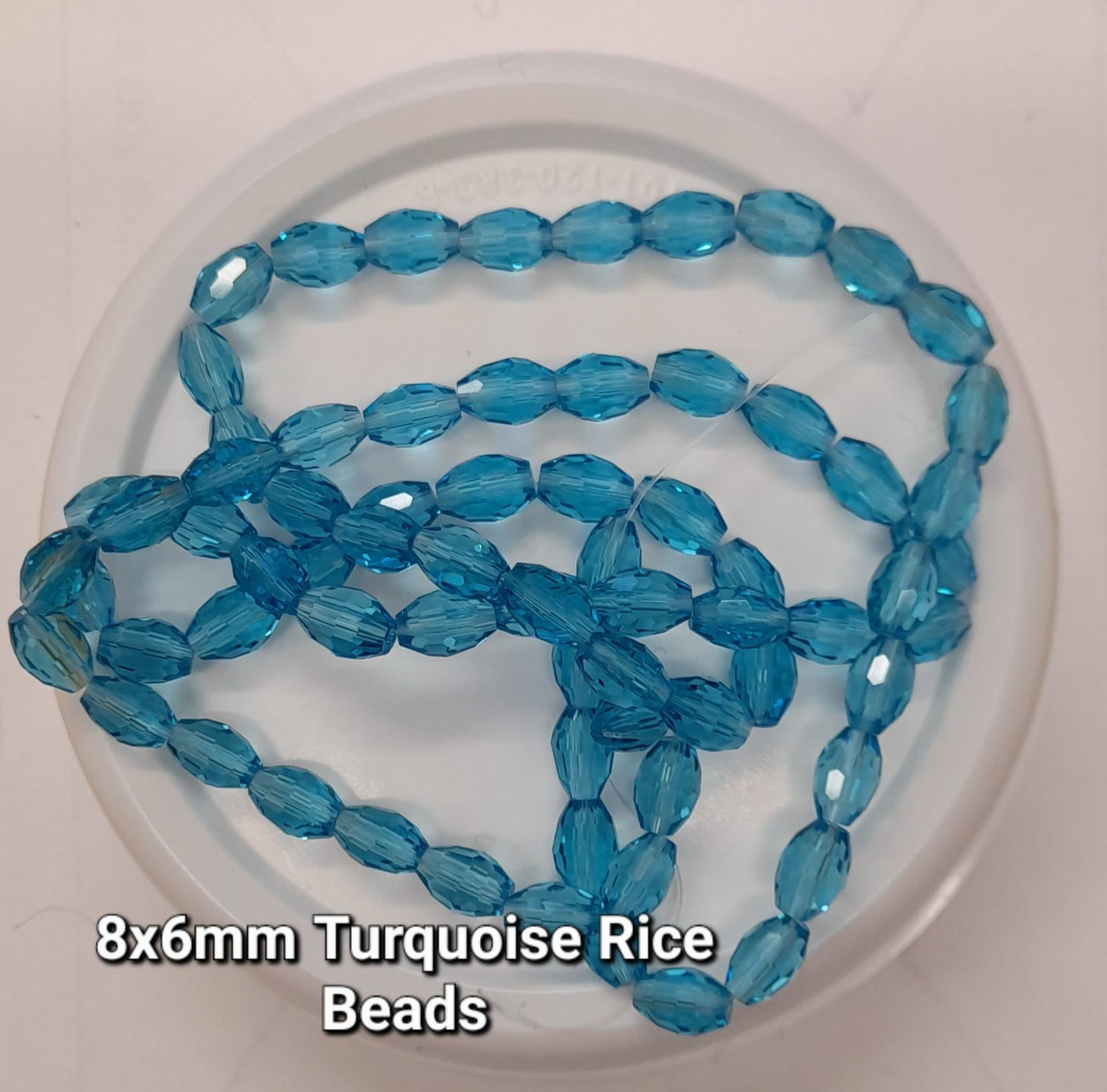 Strand of faceted rice glass beads - approx 8x6mm, TURQUOISE, approx 72 beads