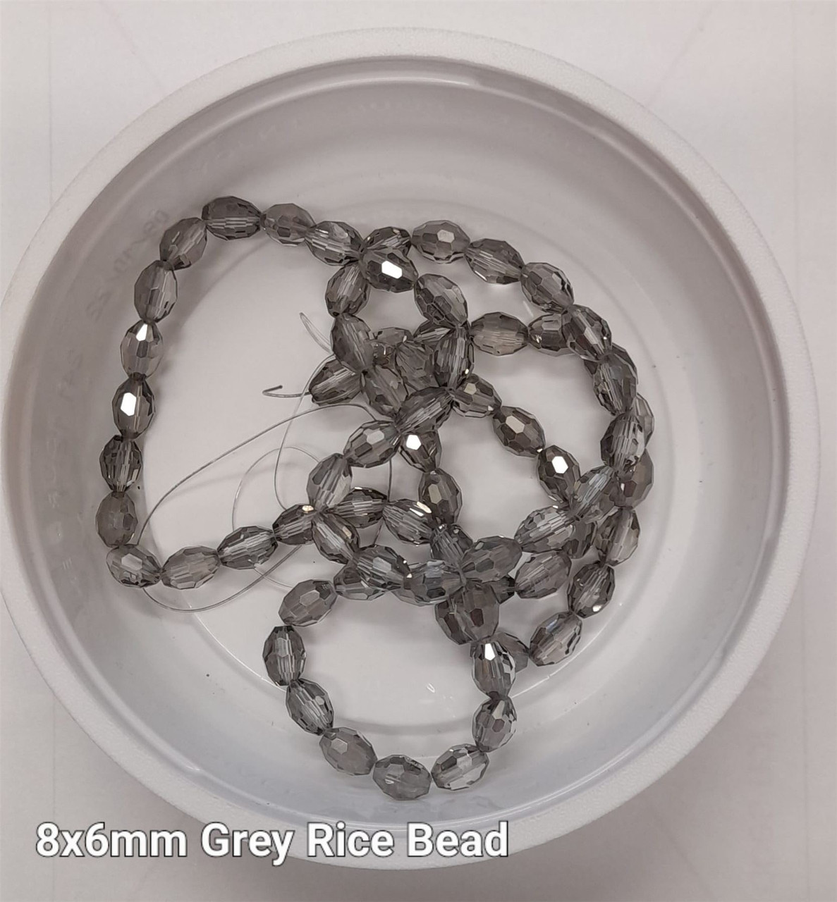 Strand of faceted rice glass beads - approx 8x6mm, Grey, approx 72 beads