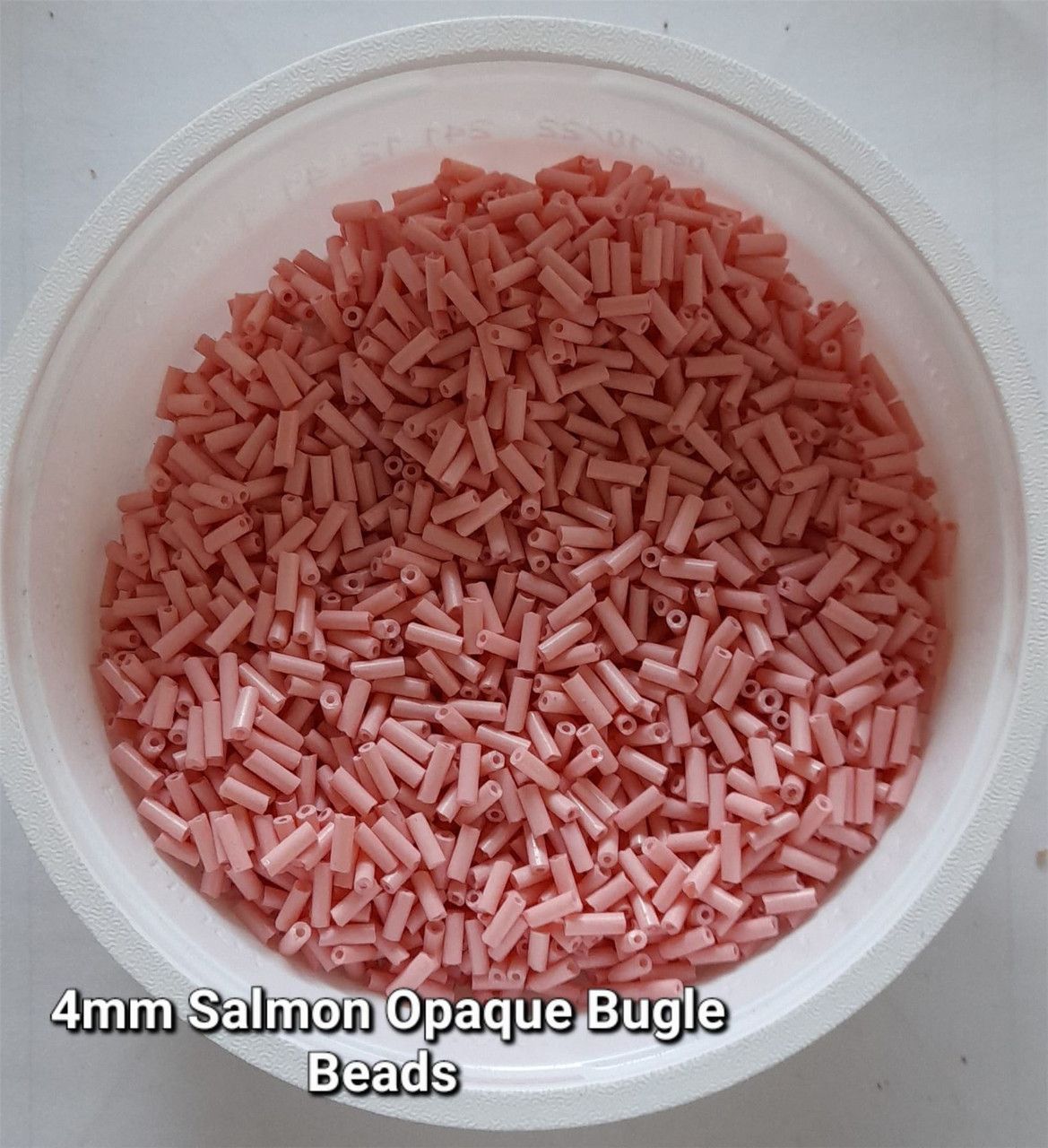50g glass bugle beads - Salmon Opaque - approx 4mm tubes