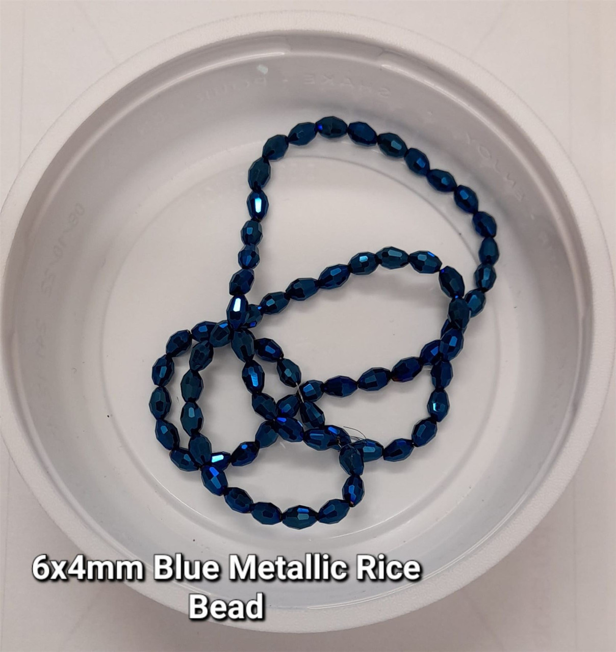 Strand of faceted rice glass beads - approx 6x4mm, Blue Metallic, approx 72 beads