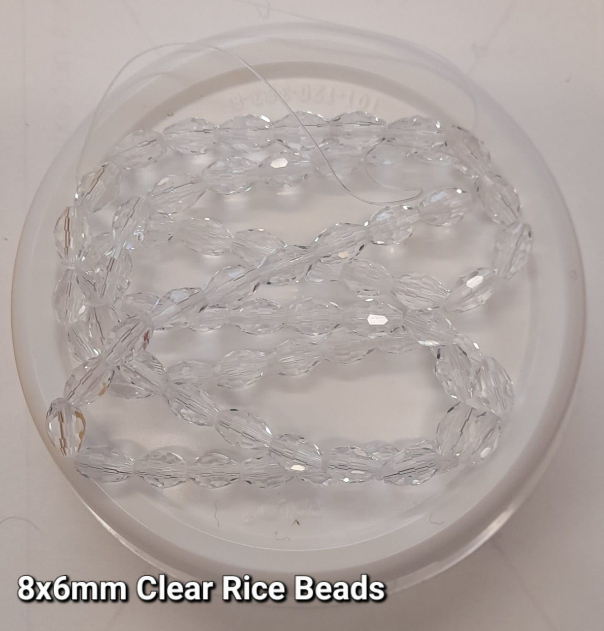 Strand of faceted rice glass beads - approx 8x6mm, CLEAR, approx 72 beads