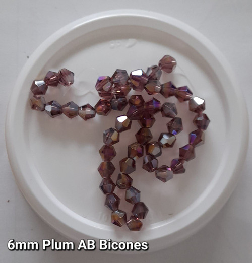 Strand of glass bicone beads - approx 6mm, Plum AB, approx 50 beads