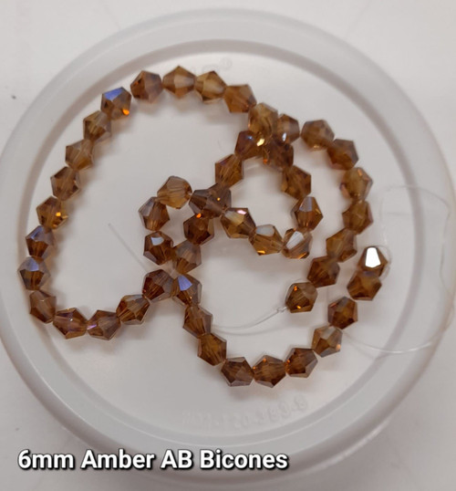 Strand of glass bicone beads - approx 6mm, Amber AB, approx 50 beads