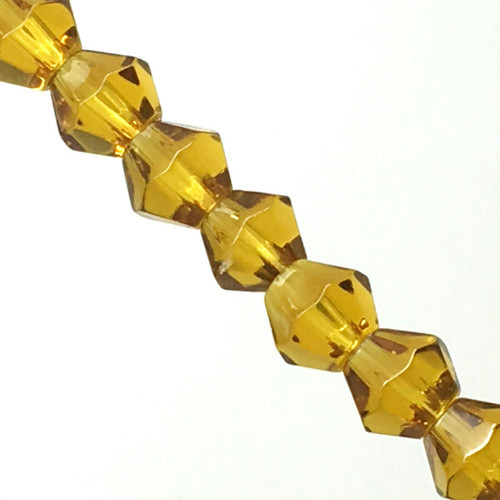 Strand of glass bicone beads - approx 6mm, Amber, approx 52 beads
