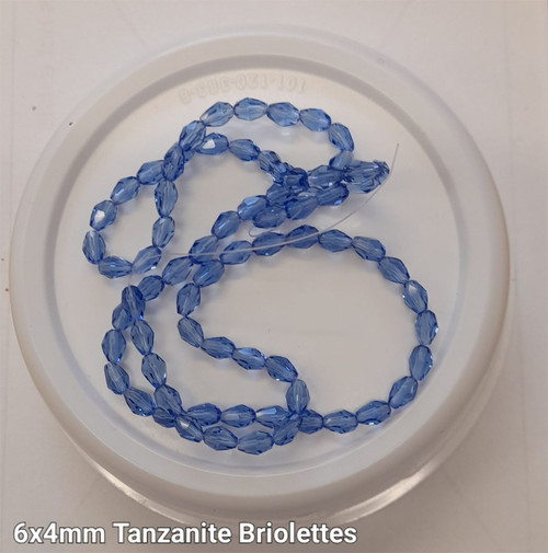 Strand of faceted drop glass beads (briolettes) - approx 6x4mm, Tanzanite (Light Blue), approx 72 beads