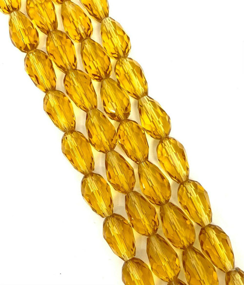 Strand of faceted drop glass beads (briolettes) - approx 6x4mm, Gold, approx 72 beads