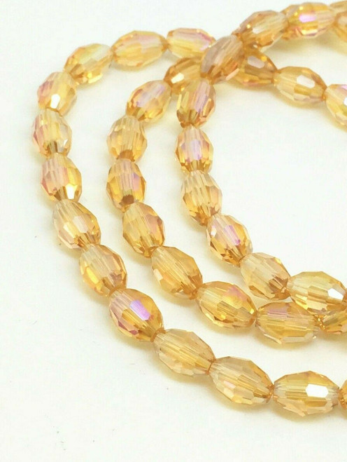 Strand of faceted rice glass beads - approx 6x4mm, Pale Gold AB , approx 72 beads