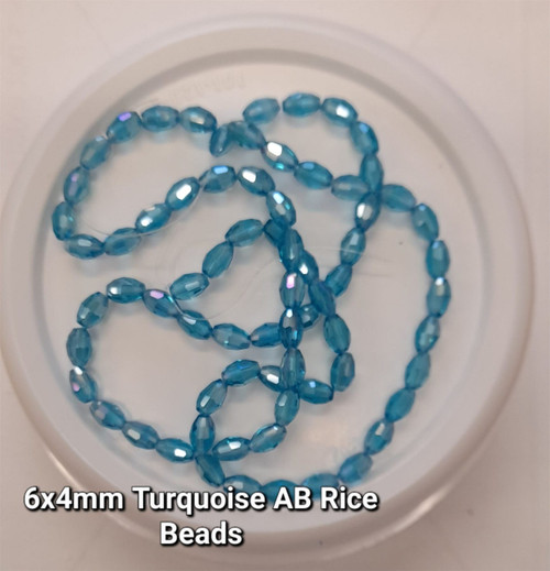 Strand of faceted rice glass beads - approx 6x4mm, Turquoise AB, approx 72 beads
