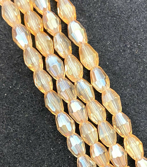 Strand of faceted rice glass beads - approx 6x4mm, Light Copper AB , approx 72 beads