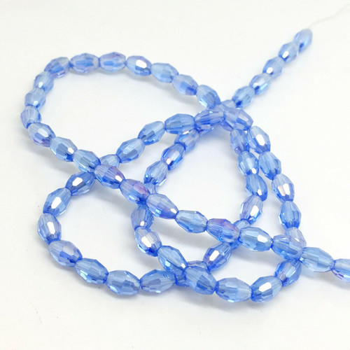 Strand of faceted rice glass beads - approx 6x4mm, Tanzanite AB , approx 72 beads