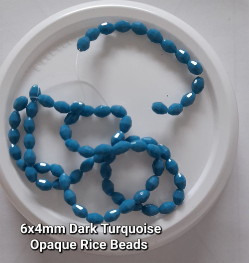 Strand of faceted rice glass beads - approx 6x4mm, Dark Turquoise Opaque, approx 72 beads