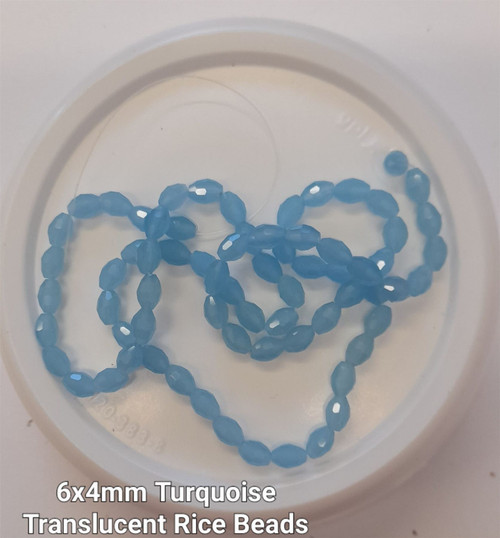 Strand of faceted rice glass beads - approx 6x4mm, Turquoise Translucent , approx 72 beads