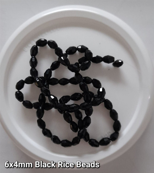 Strand of faceted rice glass beads - approx 6x4mm, Black, approx 72 beads