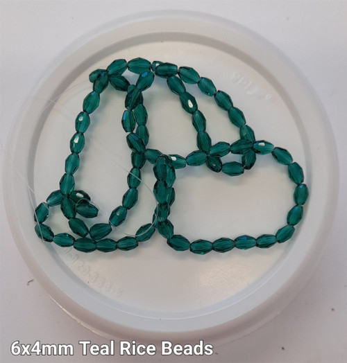 Strand of faceted rice glass beads - approx 6x4mm, Teal, approx 72 beads