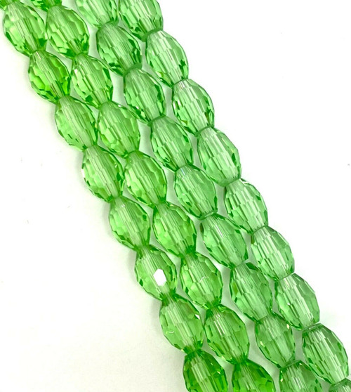 Strand of faceted rice glass beads - approx 6x4mm, Pale Green, approx 72 beads
