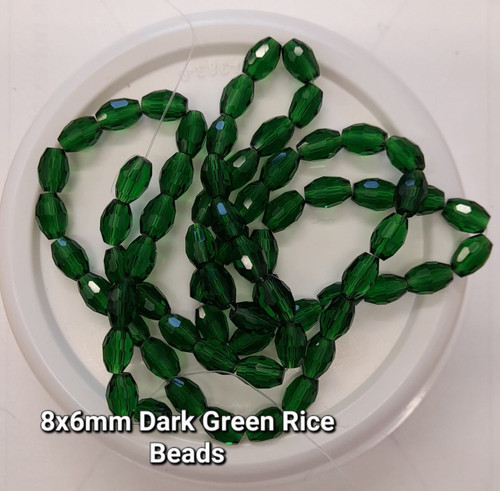 Strand of faceted rice glass beads - approx 8x6mm, Dark Green, approx 72 beads