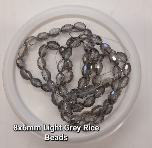 Strand of faceted rice glass beads - approx 8x6mm, LIGHT GREY, approx 72 beads
