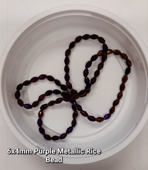 Strand of faceted rice glass beads - approx 6x4mm, Purple Metallic, approx 72 beads