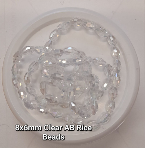 Strand of faceted rice glass beads - approx 8x6mm, CLEAR AB, approx 72 beads