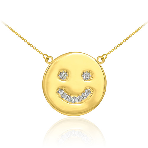 Smiley face disc necklace with diamonds in 14k yellow gold.