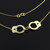 Handcuffs necklace in 14k yellow gold.