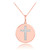 Cross disc pendant necklace with diamonds in 14k rose gold.