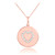 Heart disc pendant necklace with diamonds in 14k rose gold.