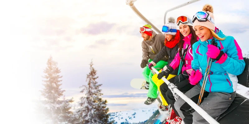 Skiers enjoying the chairlift at Stowe Vermont