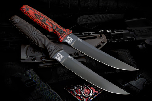 "Two Spartan-Ronin Torii knives side by side: one with a sleek black handle and the other with a distinctive red and black handle. Both knives feature a fixed blade with a trailing point design."