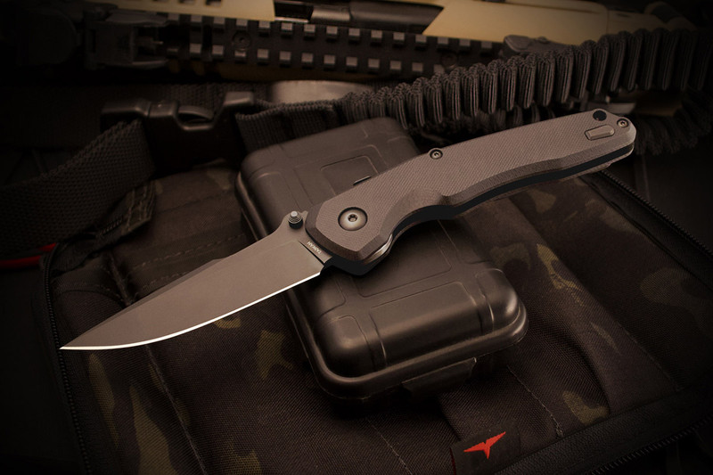 Soter Blackout Edition folding knife, clip side showing black monolithic deep-carry pocket clip, black hardware, and RaceLock spine mechanism