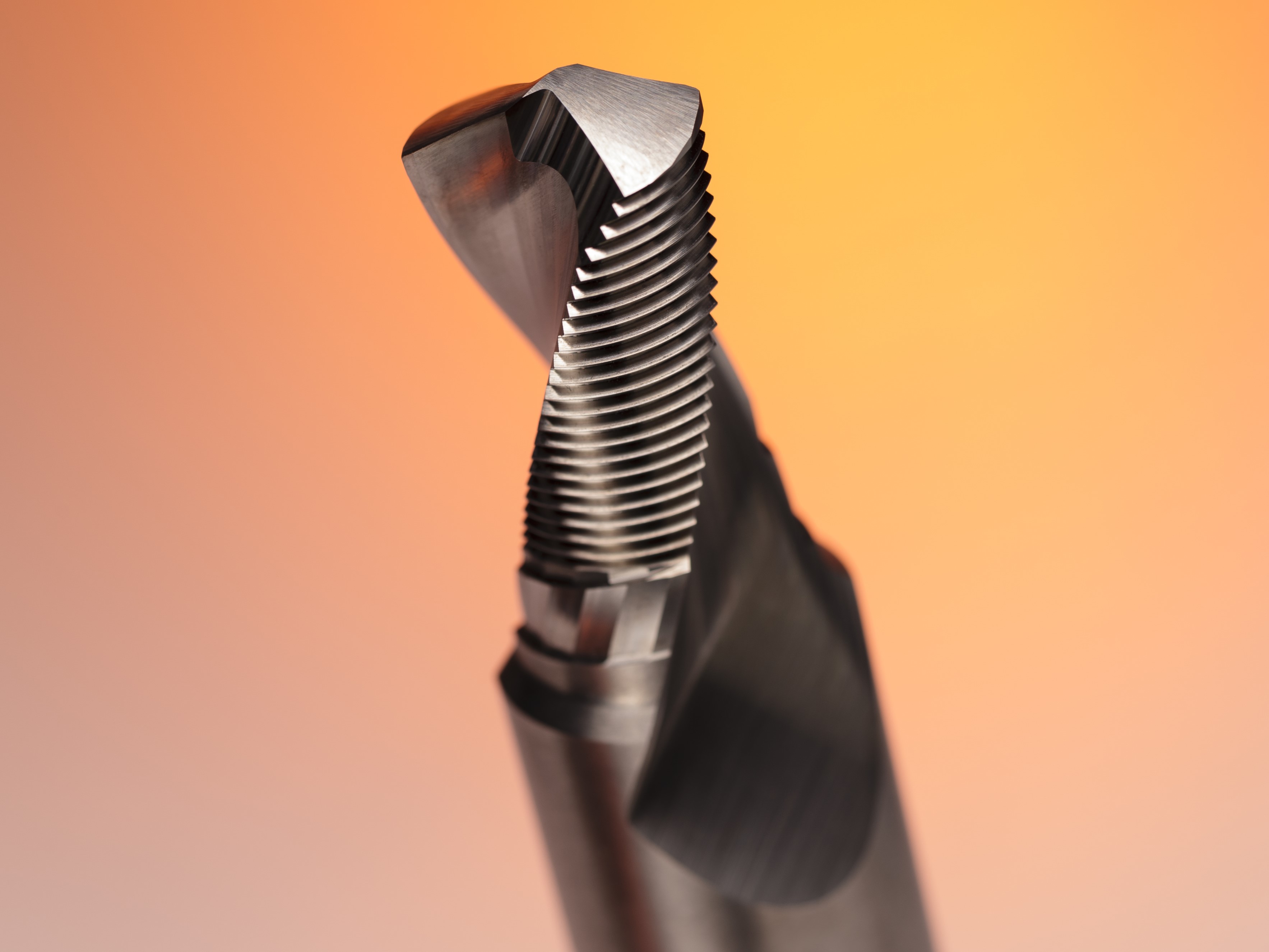 Close-up of a precision-ground cutting tool with fine serrations for advanced custom applications.