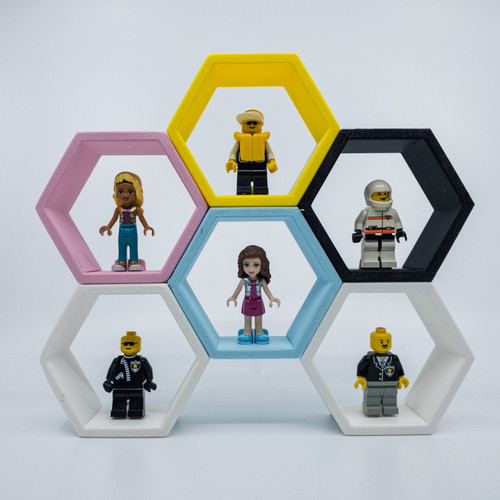 Minifigure display hexagon, connectible cells, wall mountable or free standing in a variety of colours. Suitable for LEGO© or similar minifigures. Minifigure display hexagon, connectible cells, wall mountable or free standing in a variety of colours. Suitable for LEGO© or similar minifigures.