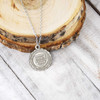 BYU Idaho Crest Necklace, silver chain, engraved pendant, university logo, circular design.