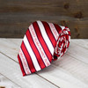 Florida Atlantic Owls Men's Tie, red and white striped with Florida Atlantic logo, displayed on a wooden surface.