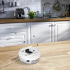 White USB powered automatic electric fly trap on a wooden kitchen counter.