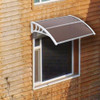 Brown 100 x 80 household application door and window awning installed above a window on a wooden house exterior.