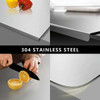 Stainless steel cutting board with lip, made of 304 stainless steel, for kitchen use, shown in a collage of images with various scenes.