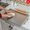 Stainless steel cutting board with lip, 60cm x 40cm, on kitchen countertop with rolling dough and utensils.